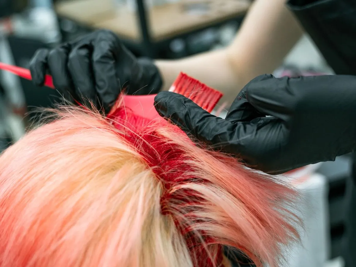 Hair colour being applied with a brush