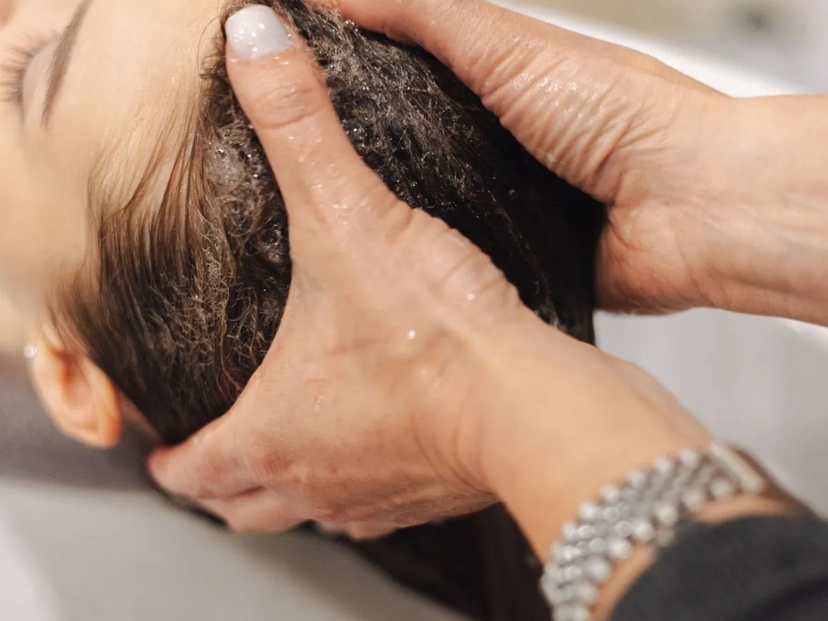 A head massage during a hair spa